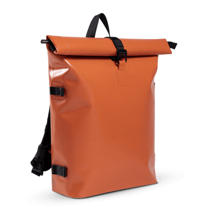 A bright orange backpack with black straps. The backpack has a sleek and modern design, perfect for carrying all your essentials on the go.